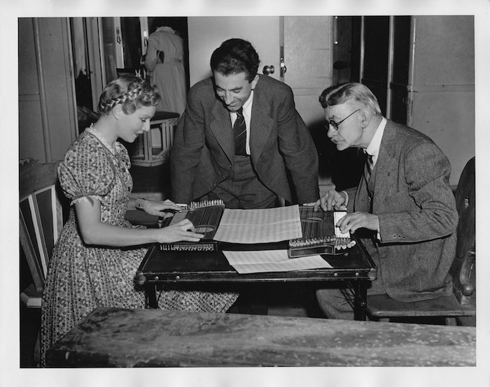 French actress Annabella learning to play the zither.