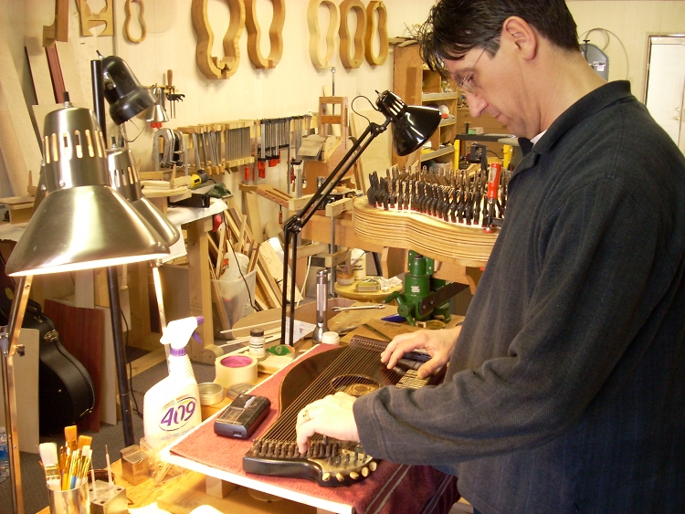 Sasha Radicic working on a zither made by Missouri's famous zither maker, Franz Schwarzer.